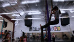 Young girl practicing aerial silk.