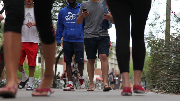 UA students walking spotlight