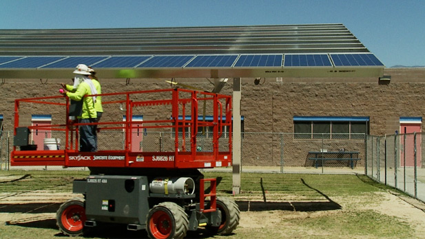 Crew installing solar panels at Tucson's Soleng Tom Elementary School in April 2014.