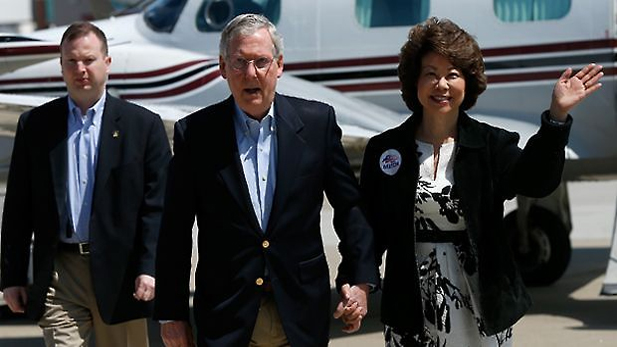 U.S. Senate Republican Leader Sen. Mitch McConnell (R-KY) arrives for a campaign rally with his wife Elaine Chao. (Win McNamee/Getty Images)