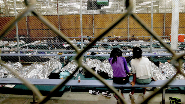 Children and teens from Mexico and Central America inside a Border Patrol detention facility in Nogales, Ariz., in 2014.