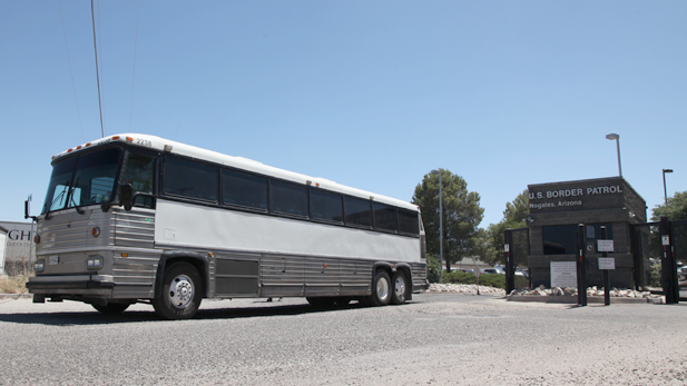 Children and teens who were caught illegally crossing into Texas leave a shelter in Nogales.  