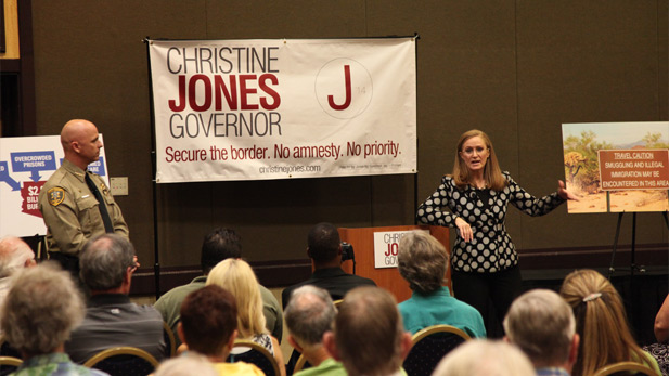 GOP gubernatorial candidate Christine Jones joined by Pinal County Sheriff Paul Babeu at a Tucson town hall meeting on immigration the evening of Thursday, July 11, 2014.