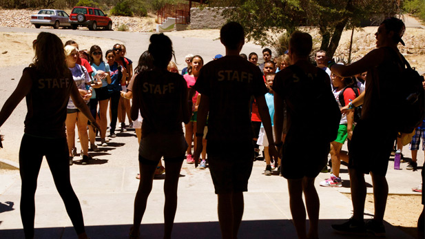 Triangle Y campers line up in front of counselors before lunch.