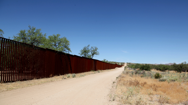 The international border fence in the Arizona desert. 