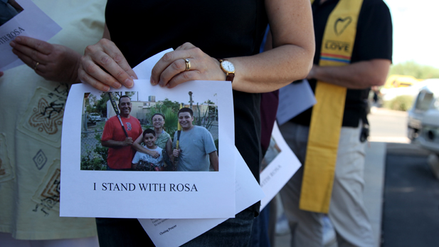 Faith-based leaders and immigrant rights activists outside Tucson's ICE offices.