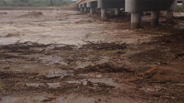 Flooding underneath La Cholla bridge at the Cañada Del Oro Wash in Tucson.