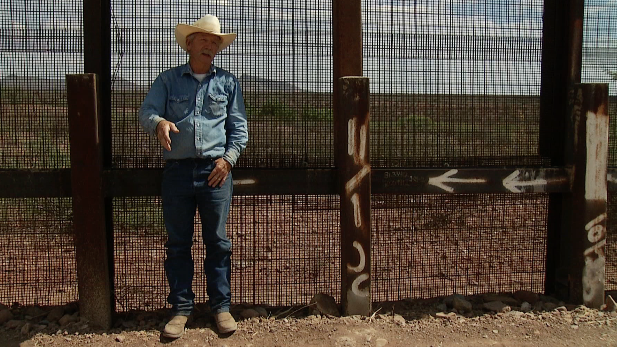 Cochise County rancher John Ladd explains how people cut the fence to cross where his ranch abuts the border.