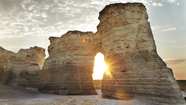 Sun shining through a gap in the rocks at Monument Rocks; Kansas.