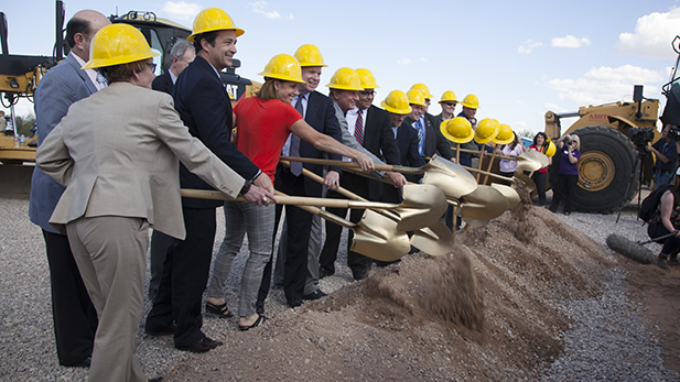 Elected officials from Tucson, Pima County and Arizona's congressional delegation scoop dirt in a ceremonial groundbreaking for the project to move Hughes Access Road a half-mile south of its location. The new road will be called Aerospace Parkway.