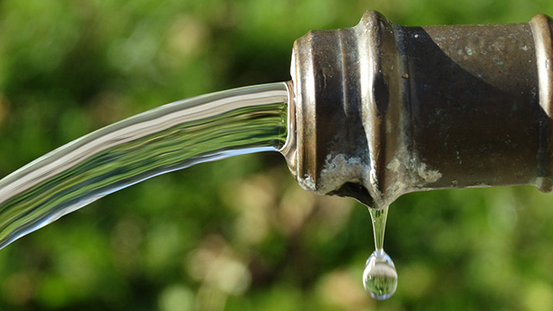 Water pours from a hose.