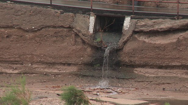 Rainwater pours into a wash in Tucson, Arizona.