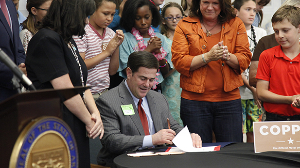 Governor Doug Ducey ceremonially signs Senate Bill 1441 on May 1, 2015. The bill was spearheaded by Copper Creek Elementary students and made into law during the regular legislative session. 