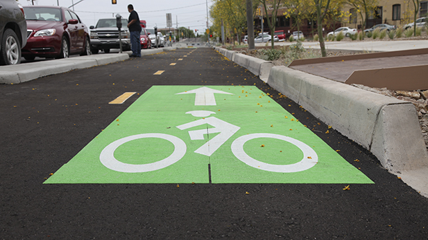 A protected bike lane on Stone Avenue between Toole Avenue and Alameda Street. 