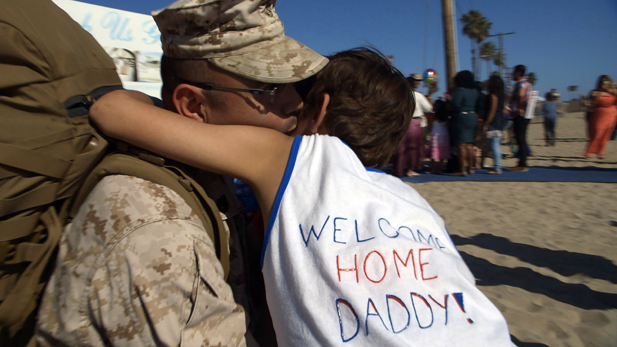 Marine Gunnery Sergeant Ramiro Gonzales is welcomed home by his son Alex after an eight month deployment.
