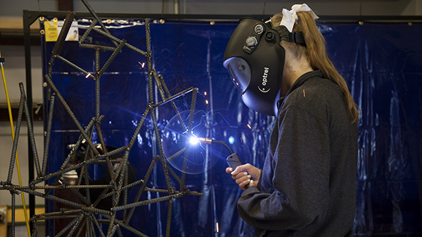 Freshman Katie Hicks welds at the Cracchiolo Family Science Technology Engineering and Mathematics Center on April 23, 2015. 