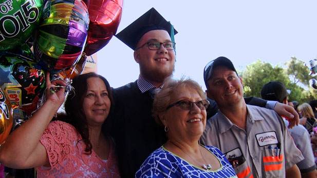 graduating forster with family spotlight