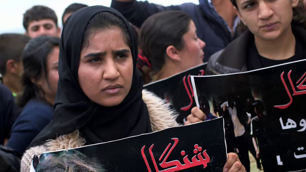 A group of Yazidi women demands international help to rescue their relatives abducted by ISIS at a protest in a camp for displaced people in Dohuk, North Iraq.
