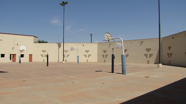 On this day the Western Navajo Nation Juvenile Detention Center's courtyard is empty. The tribe can't afford rehabilitative services or treatment for its youth.