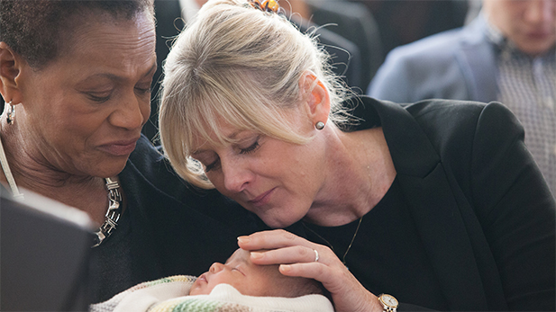 GINIKA (Michelle Hurst) and CAROLINE (Sarah Lancashire) and CELIA (Anne Reid) sit in church.