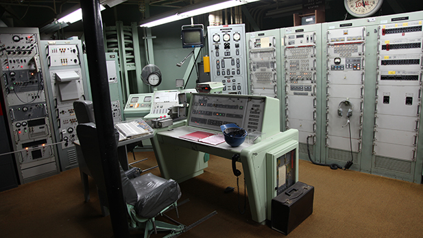 The control room where a Titan II missile would have been launched from. The room was staffed by at least two people at all times from when the site went online until it was decommissioned, but had spots for all four crew members to work from.