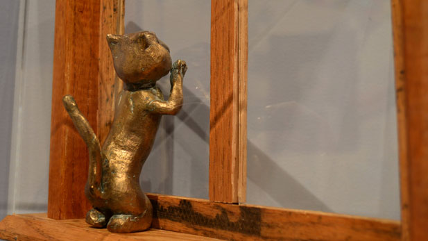 bronze cat sculpture spotlight