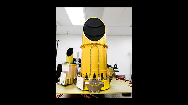 UA’s completed camera suite, OCAMS, sits on a test bench that mimics its arrangement on the OSIRIS-REx spacecraft. The three cameras that compose the instrument are the eyes of NASA’s OSIRIS-REx mission. They will map the asteroid Bennu, help choose a sample site, and ensure that the sample is correctly stowed on the spacecraft.
