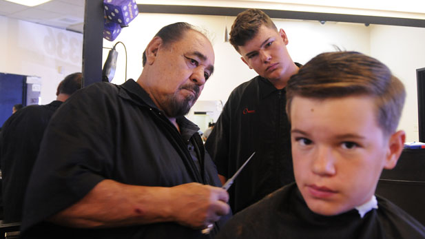 Ray Campas teaches a student at the Hollywood Barber College.
