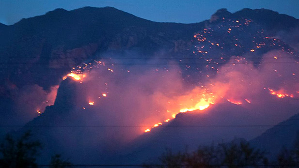 A lightning-caused fire burns near Finger Rock in the Catalina Mountains; August 5, 2015.