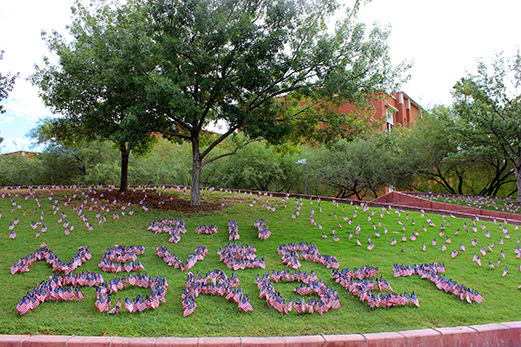 The University of Arizona College Republicans put nearly 3,000 flags on campus for the fourteenth anniversary of the terror attacks on Sept. 11, 2001 in memorial of the lives lost. Some of the flags are arranged to spell out "9/11 never forget."