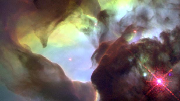 This NASA Hubble Space Telescope (HST) image reveals a pair of one-half light-year long interstellar "twisters," eerie funnels and twisted-rope structures in the heart of the Lagoon Nebula (Messier 8) which lies 5,000 light-years away in the direction of the constellation Sagittarius. 