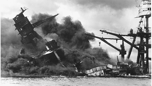 The battleship USS ARIZONA sinking after being hit by Japanese air attack on Dec. 7,1941.
