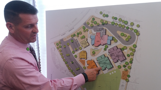 Principal Michael McConnell reviews a map of the Innovation Academy.