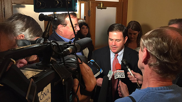 Governor Doug Ducey meets with reporters in Phoenix to talk about the law suit against the minimum wage increase.  December 19, 2016