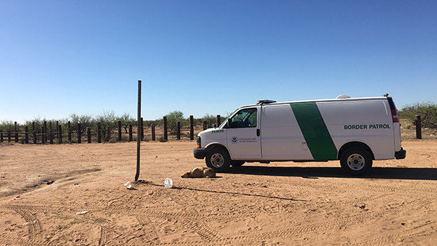 A lone Border Patrol agent watches over the San Miguel Gate.