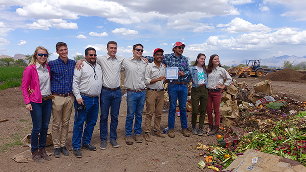 Members of the Compost Cats show their EPA award at the San Xavier Cooperative Farm.