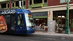 The streetcar passes Proper restaurant on Congress Street on April 5, 2016.