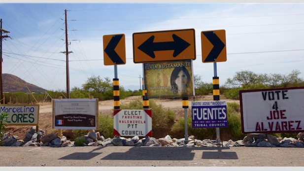 Pascua Yaqui campaign signs at South Camino de Oeste and Calle Torim.