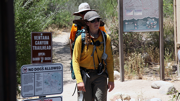 Volunteers with Southern Arizona Rescue Association return to the trailhead June 20. A hiker went missing, one was rescued and a third died on the trail June. 19, and the search continues for the missing hiker.