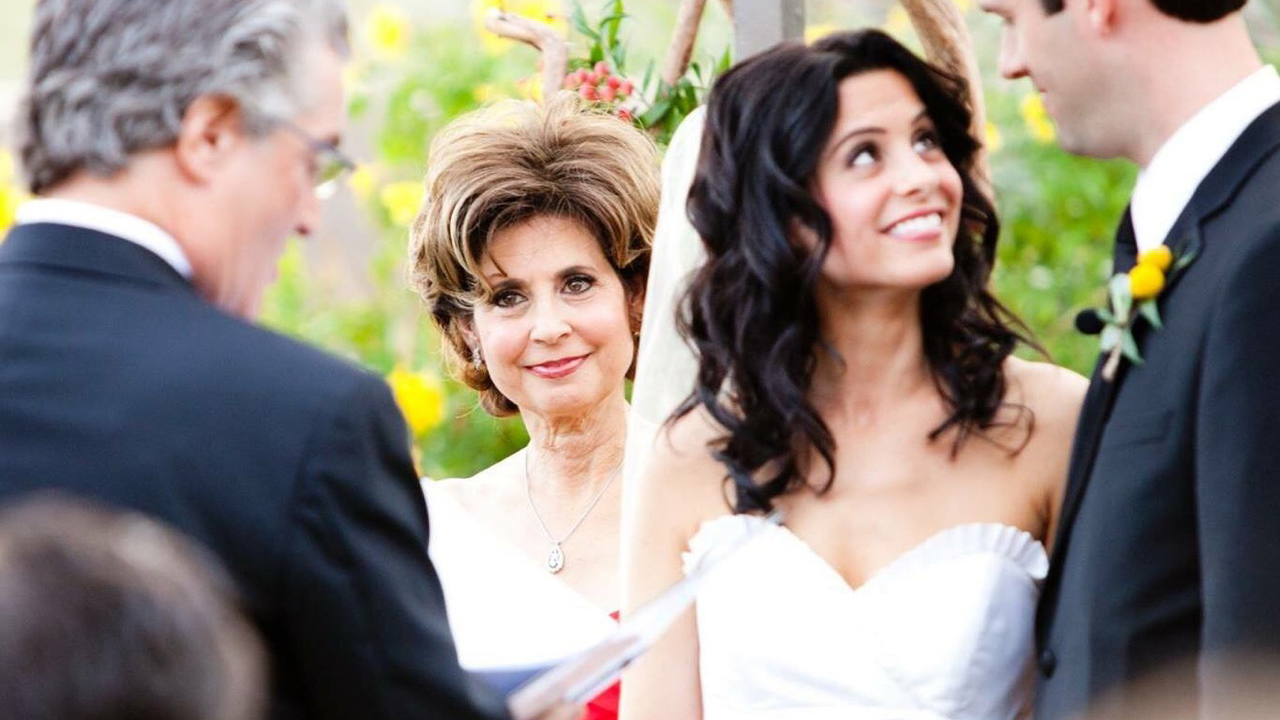 Terry Goldberg watches as her husband Lance officiates their younger daughter Lauren's 2010 wedding. 