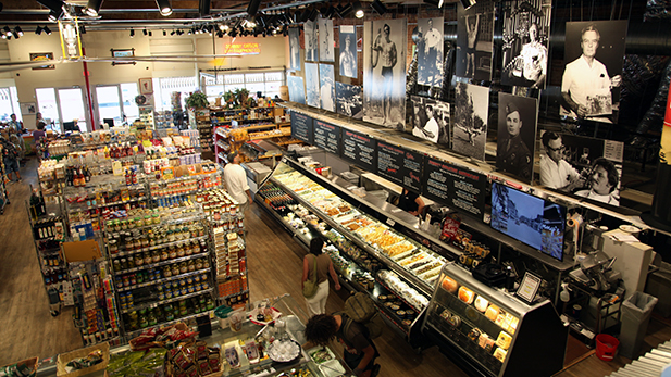 Johnny Gibson's Downtown Market opened in 2015, the only grocery store downtown. Its namesake is former barber and gym equipment retailer, shown in black and white photos above the deli.