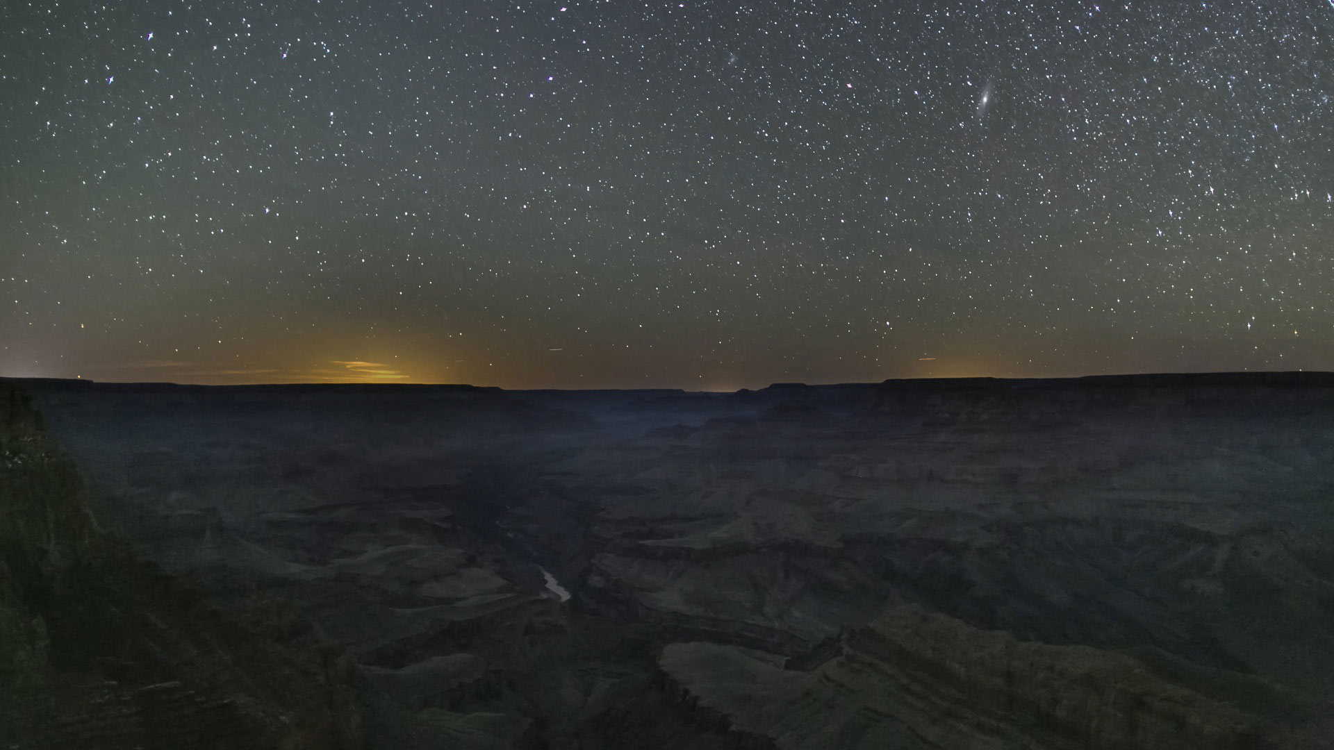 A field of stars lights up the night sky above the Grand Canyon in northern Arizona.