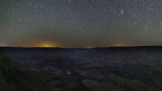 A field of stars lights up the night sky above the Grand Canyon in northern Arizona.