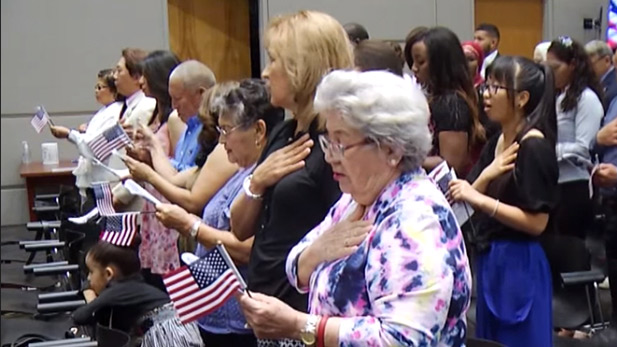 New Americans are granted citizenship.