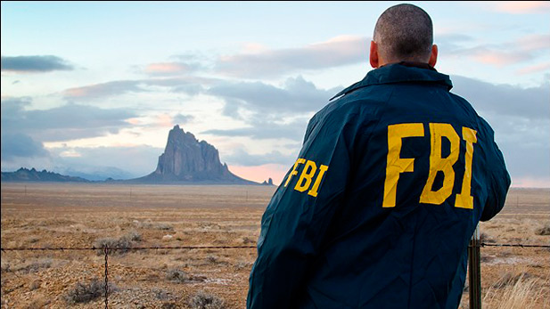 A special agent overlooks the Shiprock land formation on the Navajo Nation in New Mexico. The reservation, the largest in the country, is one of about 200 federally recognized Indian reservations where the FBI has investigative responsibilities.