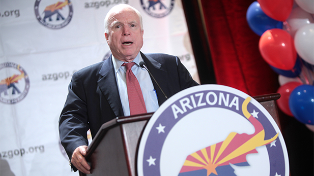 John McCain speaking podium spotlight