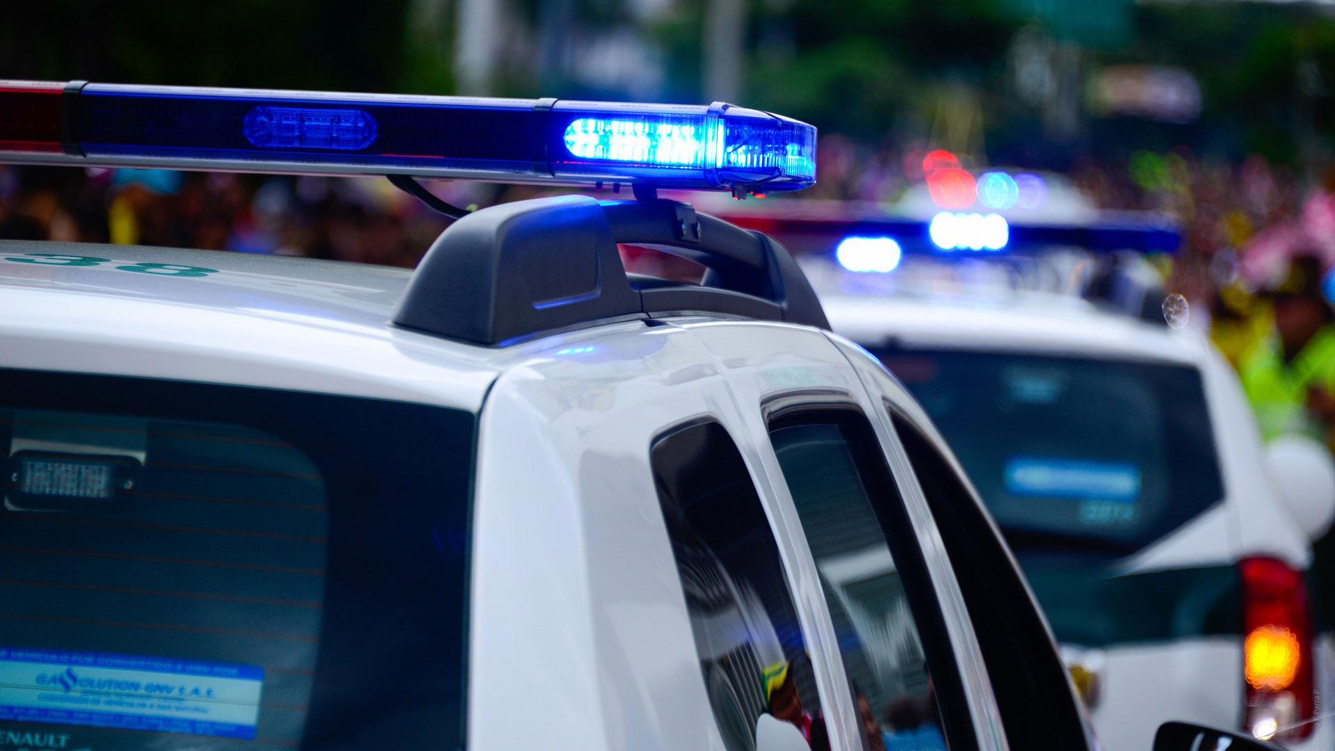 Flashing lights on top of a police car.