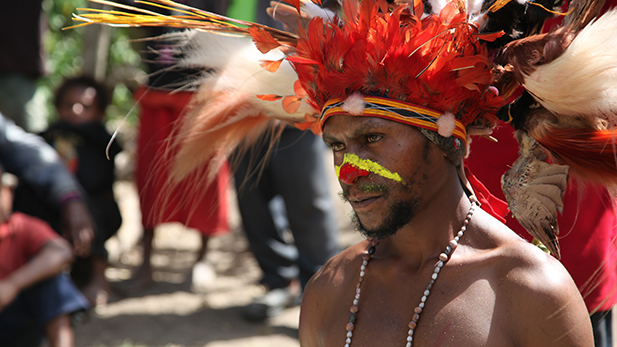 Peter Kiap dressed for the Sing Sing. A ceremony in which he must dress in his traditional costume, made up of feathers from Birds of Paradise.