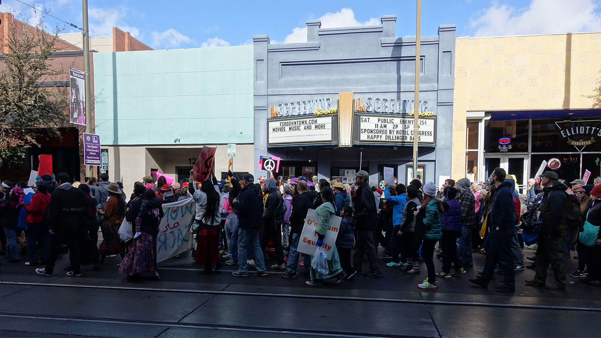 People at the Tucson's Women's March as it passes by the Screening Room in downtown Tucson, Jan. 21, 2017.