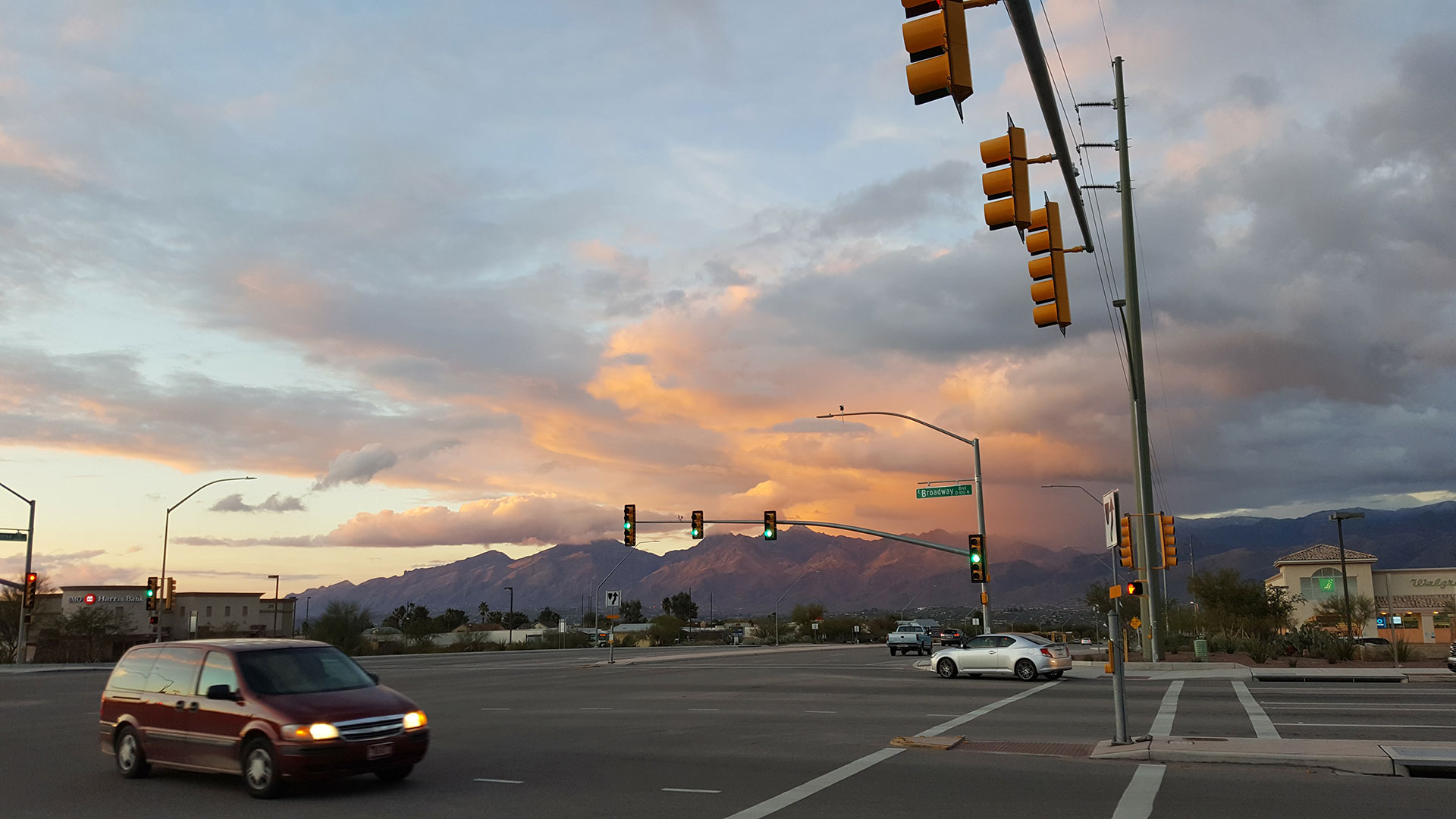 Cars drive through the intersection of Broadway Boulevard and Houghton Road on Tucson's east side.